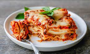 Lasagna on a plate with a fork.